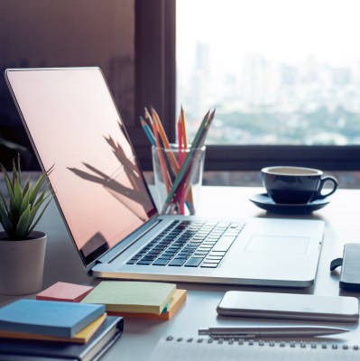 Modern work table with computer laptop and cityscapes view
from window.Business concepts ideas.Strategy analysis